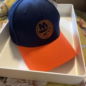Islander Navy and Orange Strapback Hat
